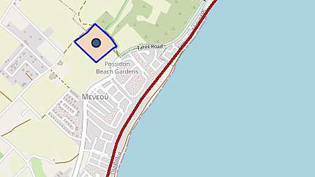 Large plot of land near the sea with plans for 57 houses.